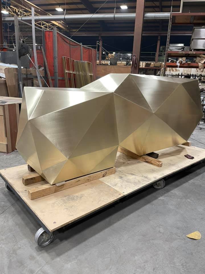 geometric shaped desk with brass finish