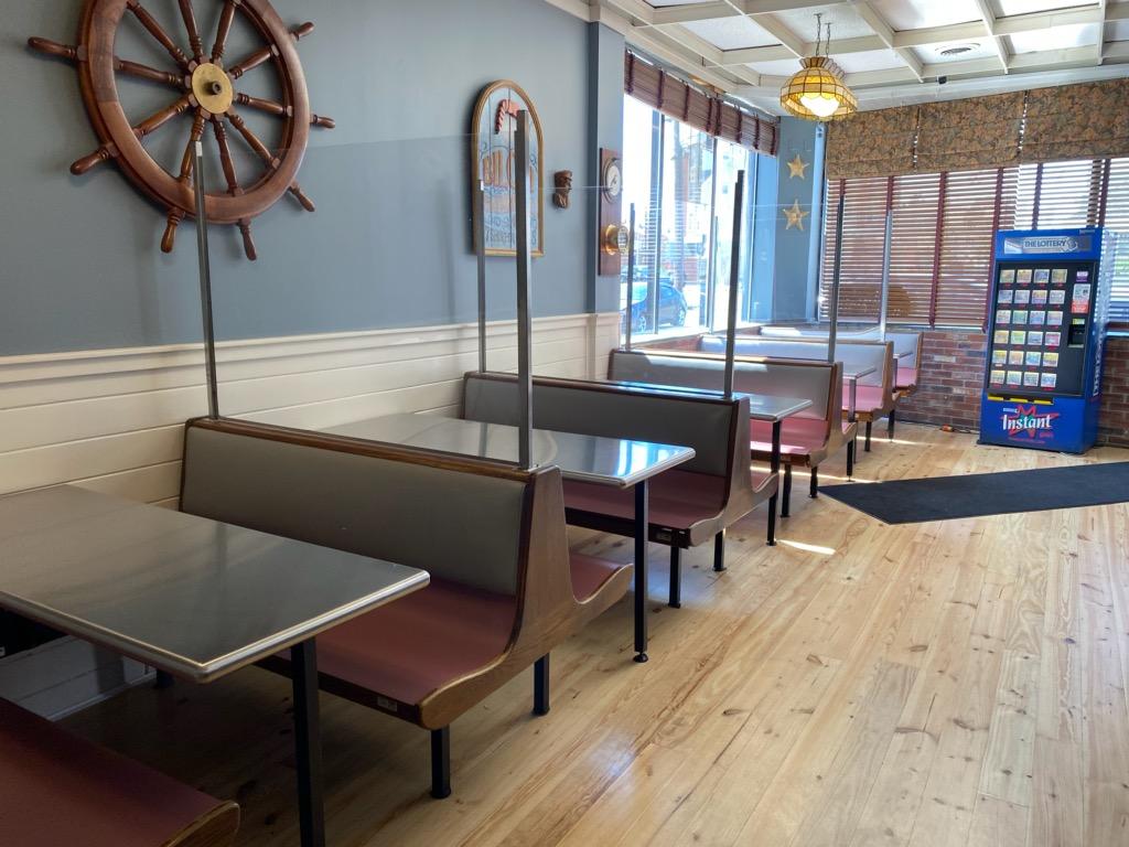 restaurant booth seating with stainless steel tables